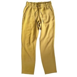 Lululemon On the Fly Woven 7/8 Pants Vintage Gold Size 4